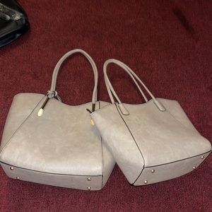 Two matching purses with a wallet/clutch attached to larger bag. Barely used.